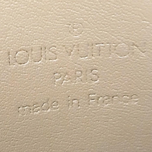 332 - A Louis Vuitton Vernis Tompkins Square Beige Bag. LV monogram embossed vernis patent leather exterio... 