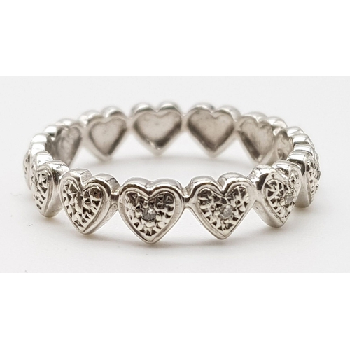 285 - 9K WHITE GOLD DIAMOND SET HEART BAND RING 2.7G SIZE N