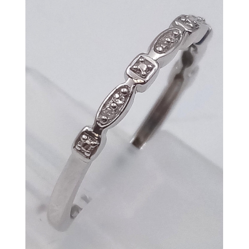 615 - 9K WHITE GOLD DIAMOND BAND RING 1.2G SIZE K