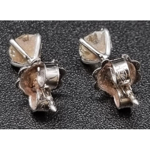 1080 - A pair of 18k white gold diamond earrings, 0.72cts of diamonds