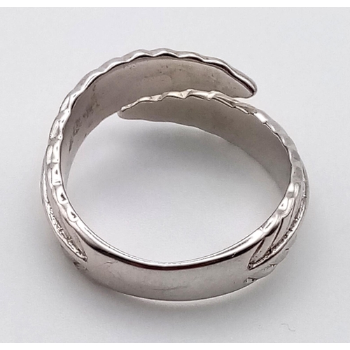 1099 - 4 LADIES SILVER FASHION RINGS.  20.3gms