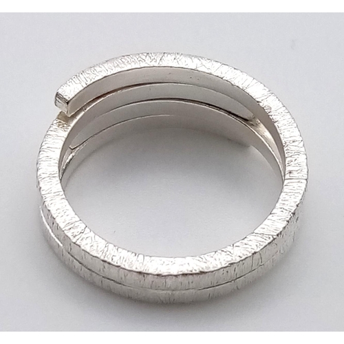 1099 - 4 LADIES SILVER FASHION RINGS.  20.3gms