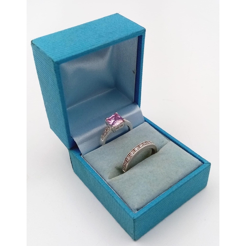 1106 - 2 BOXED SILVER RINGS WITH PINK STONE.5.7gms  size L/M