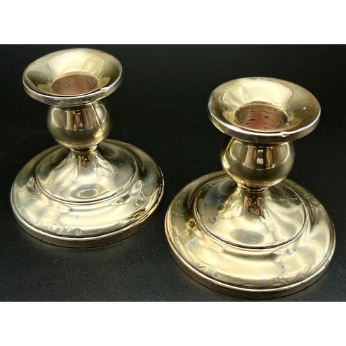 1136 - A Pair of Antique Sterling Silver Candle Sticks. 8cm tall.
Weighted. 461g total weight.