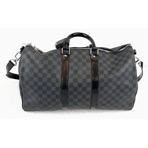 227 - A Louis Vuitton Keepall 45 Bandouliere. Crafted in luxurious darnier graphite checked canvas. In goo... 