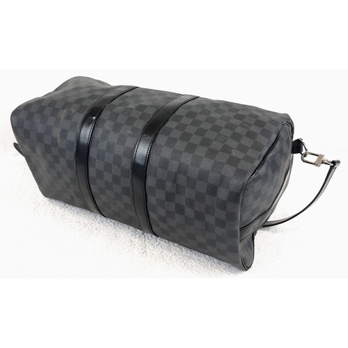 227 - A Louis Vuitton Keepall 45 Bandouliere. Crafted in luxurious darnier graphite checked canvas. In goo... 