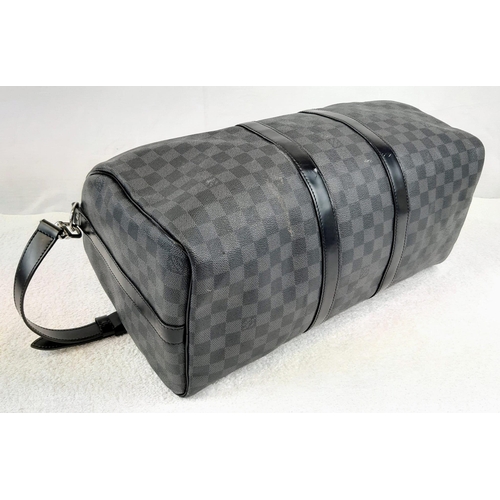 227 - A Louis Vuitton Keepall 45 Bandouliere. Crafted in luxurious darnier graphite checked canvas. In goo... 