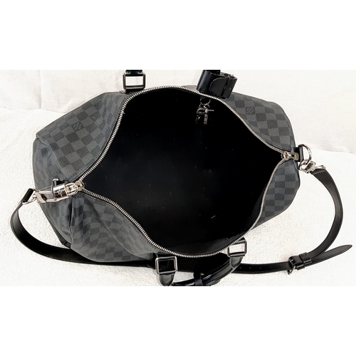 227 - A Louis Vuitton Keepall 45 Bandouliere. Crafted in luxurious darnier graphite checked canvas. In goo... 