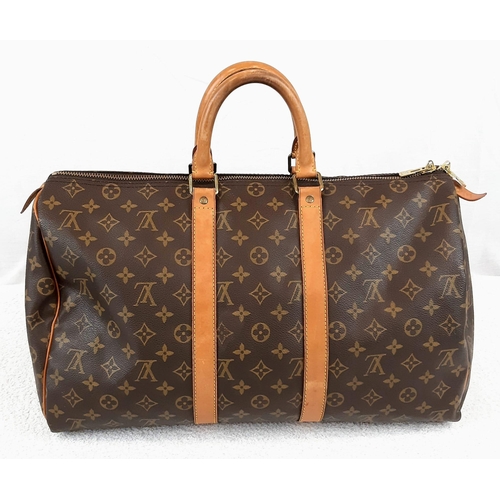 250 - A Louis Vuitton Traditional Monogrammed Canvas Keepall Badouliere 45. In good condition but please s... 