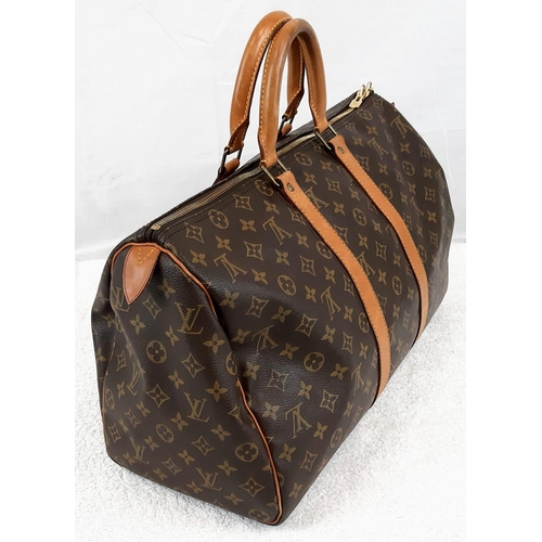 250 - A Louis Vuitton Traditional Monogrammed Canvas Keepall Badouliere 45. In good condition but please s... 