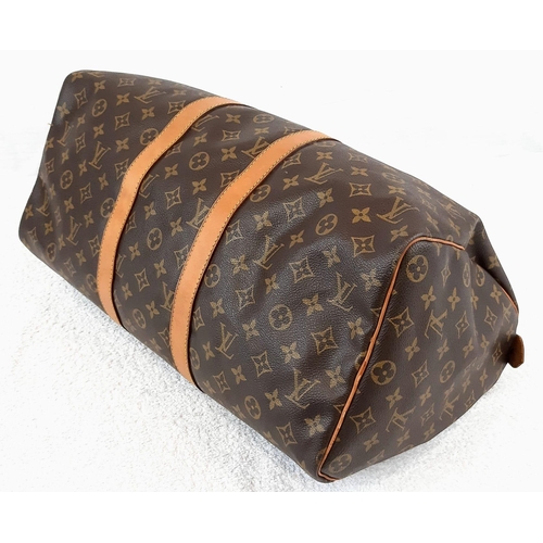 250 - A Louis Vuitton Traditional Monogrammed Canvas Keepall Badouliere 45. In good condition but please s... 