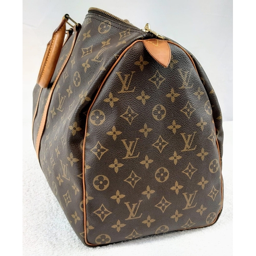 250 - A Louis Vuitton Traditional Monogrammed Canvas Keepall Badouliere 45. In good condition but please s... 