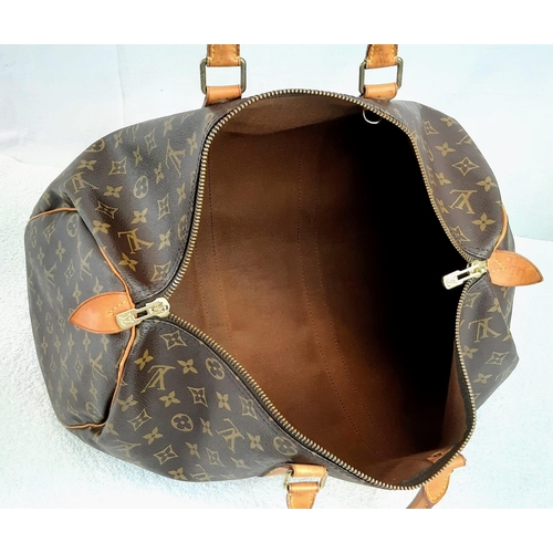 250 - A Louis Vuitton Traditional Monogrammed Canvas Keepall Badouliere 45. In good condition but please s... 