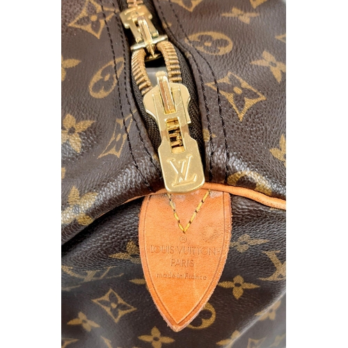 250 - A Louis Vuitton Traditional Monogrammed Canvas Keepall Badouliere 45. In good condition but please s... 