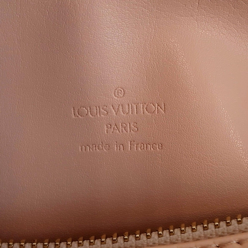 311 - A Louis Vuitton White Monogrammed Vernis Bedford Handbag. Gold tone and leather straps. Pink leather... 