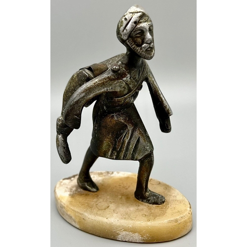 549 - An Antique Islamic Indian Hunter Figure - white metal on a marble base. 18.5 x 13.5cm.