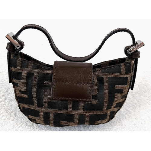 318 - A Fendi Mini-Moon Bag. Brown canvas and leather exterior with the signature Zucca monogram pattern. ... 