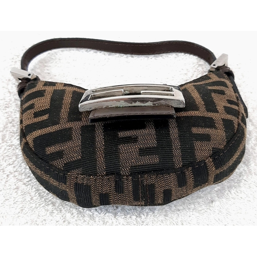 318 - A Fendi Mini-Moon Bag. Brown canvas and leather exterior with the signature Zucca monogram pattern. ... 