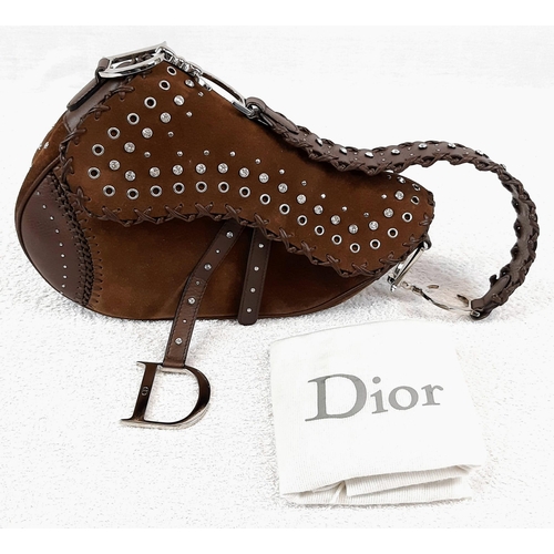 89 - A Christian Dior Suede Studded Saddle Bag. Decorated with studs and crystals - the suede body has a ... 