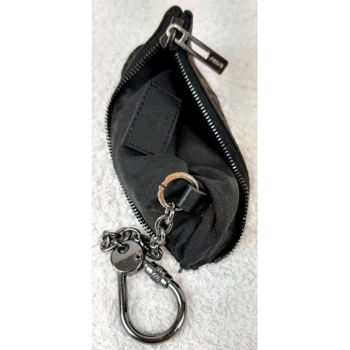 713 - A Fendi Monogrammed Brown Key Chain Pouch. Canvas and leather with a Fendi key chain attached. In go... 