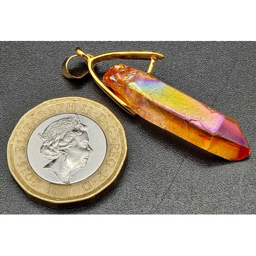 876 - A Titanium Stone Pendant set in a gilded attachment.
4cm.