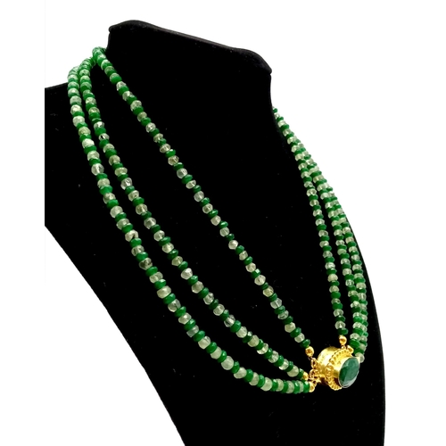 133 - A very feminine, 3 row faceted emerald and peridot necklace and bracelet set with large emerald clas... 