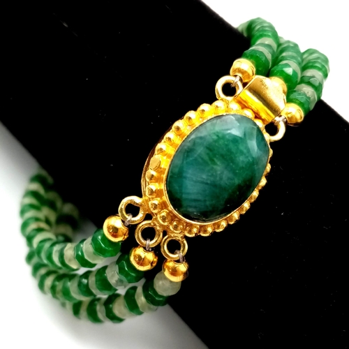 133 - A very feminine, 3 row faceted emerald and peridot necklace and bracelet set with large emerald clas... 