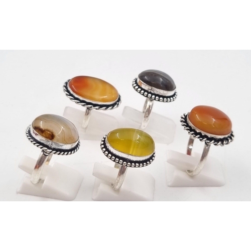 238 - Five white metal (untested) Botswana Agate rings presented in rose shaped velvet boxes.
(Size: N,V,P... 