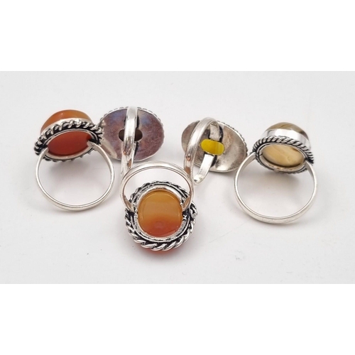 238 - Five white metal (untested) Botswana Agate rings presented in rose shaped velvet boxes.
(Size: N,V,P... 