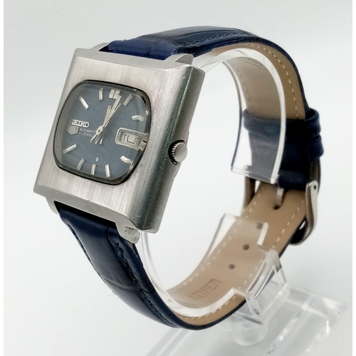 336 - Seiko stainless steel oblong TV blue automatic 21 jewel watch with leather strap. 38mm x 34mm. 25cm.