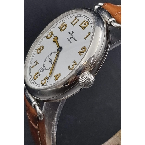 56 - A vintage stainless steel swiss made Longines unisex automatic wristwatch circular white face with o... 