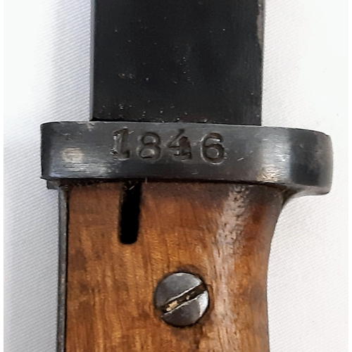 146 - Spanish M1943 Mauser K98 bayonet with scabbard. Makers mark 'PR8' on cross-guard. Wooden grips. In v... 