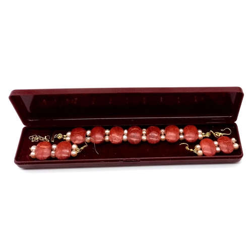 154 - A fabulous red coral and pink pearls bracelet and earrings set in a presentation box. Bracelet lengt... 