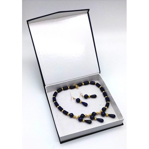 203 - A desirable lapis lazuli and gilded spacers necklace and earrings set in a presentation box. Necklac... 