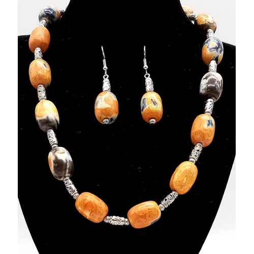 217 - A rarely seen and very collectable orange and black Namibian agate necklace and earrings set. Neckla... 