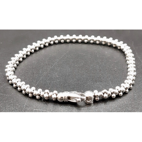 9 - An 18K White Gold Designer Ball-Link Bicego Bracelet.
18cm. 11.93g