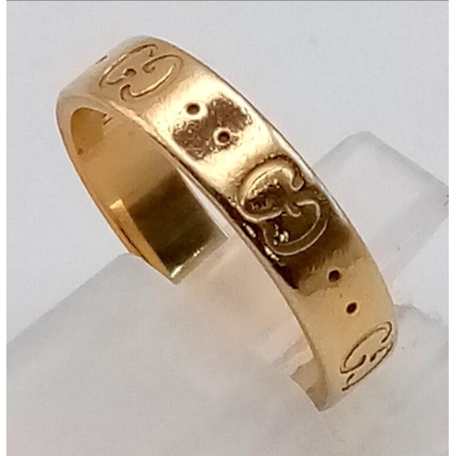 121 - An 18K Yellow Gold GUCCI Band Ring. Size K 1/2. 3.95g total weight.