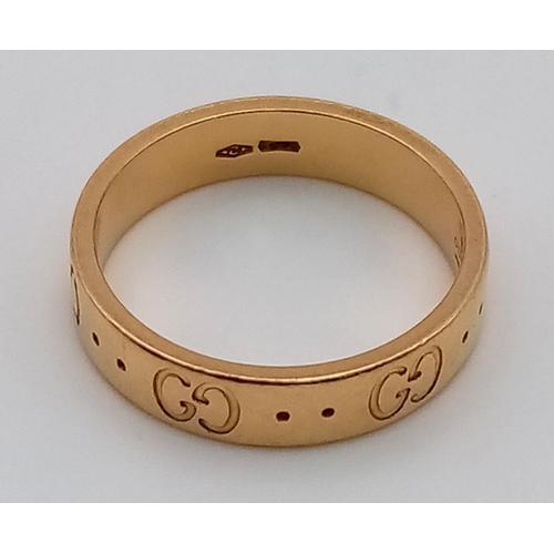 121 - An 18K Yellow Gold GUCCI Band Ring. Size K 1/2. 3.95g total weight.