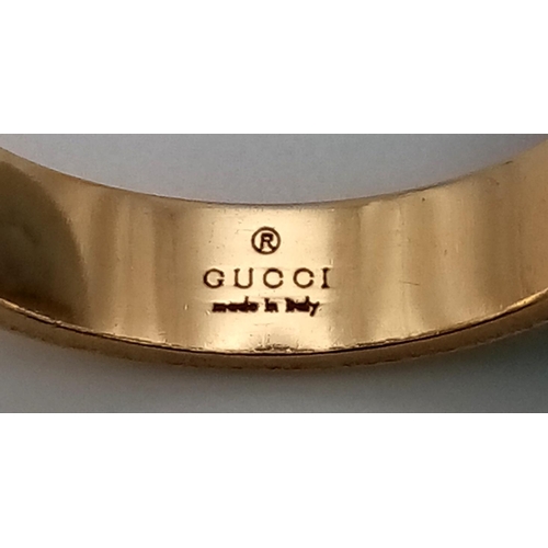 121 - An 18K Yellow Gold GUCCI Band Ring. Size K 1/2. 3.95g total weight.