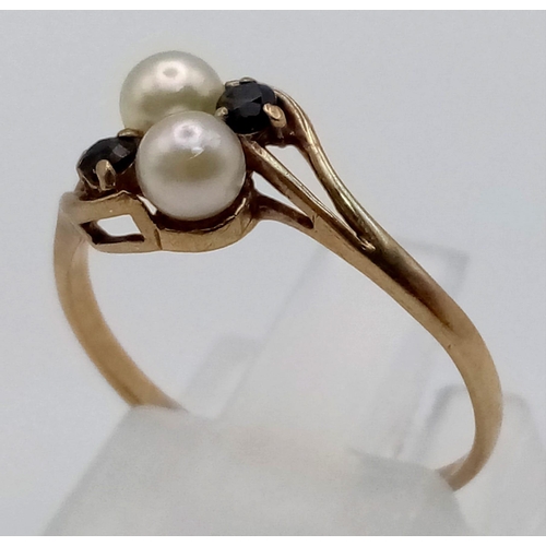 100 - A Vintage 9K Yellow Gold Seed Pearl and Sapphire Crossover Ring. Size L. 1.22g total weight.