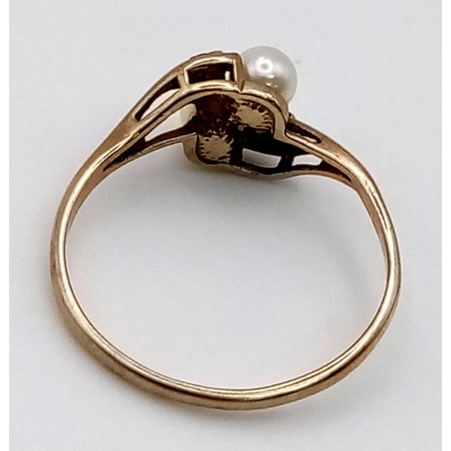 100 - A Vintage 9K Yellow Gold Seed Pearl and Sapphire Crossover Ring. Size L. 1.22g total weight.