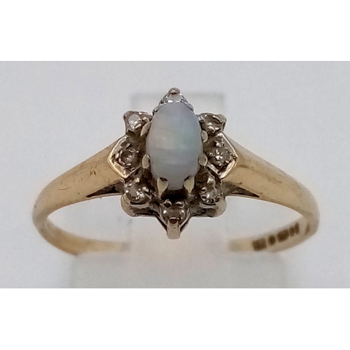 211 - A Vintage 9K Yellow Gold Opal and Diamond Ring. Central fire opal surrounded by a halo of small diam... 