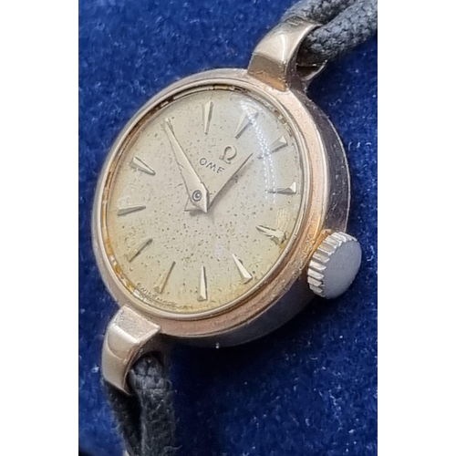 25 - A Vintage 9K Yellow Gold Ladies Omega Watch. 9K yellow Gold part-strap and case - 20mm. Gold dial. M... 