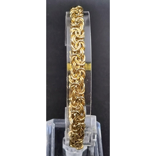 5 - An Italian 9K Yellow Gold Entwined-Link Bracelet. 18cm.
7.12g total weight.