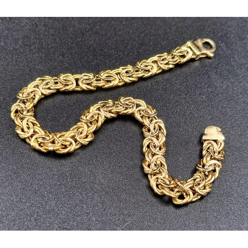 5 - An Italian 9K Yellow Gold Entwined-Link Bracelet. 18cm.
7.12g total weight.