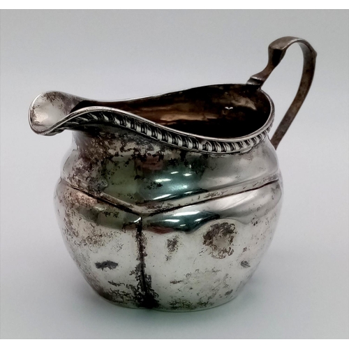 597 - An Antique 925 Silver Creamer Jug. Hallmarks for Birmingham 1903. 61.42g total weight. 11 x 7cm.