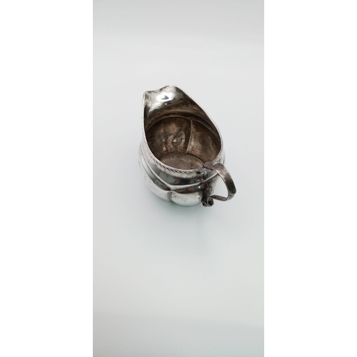 597 - An Antique 925 Silver Creamer Jug. Hallmarks for Birmingham 1903. 61.42g total weight. 11 x 7cm.