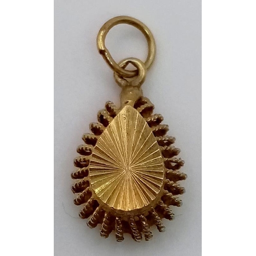 670 - A Vintage 9K Yellow Gold Psychedelic Effect Pendant. 12mm.