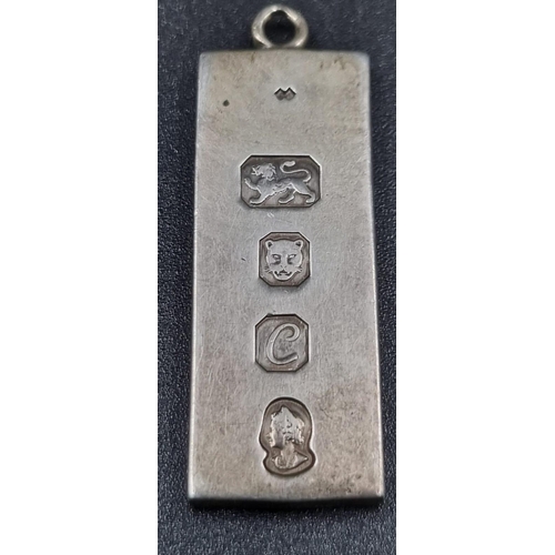 586 - Six Different Style Silver Pendants - including a silver ingot. 25.39g total weight.