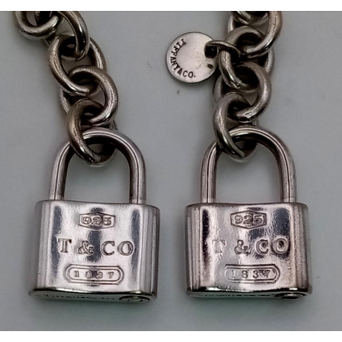 595 - A Tiffany and Co 925 Silver Double 1837 Padlock Bracelet. 18cm. 26.7g total weight.